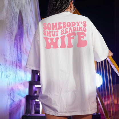 "Somebody's Smut Reading Wife" Pink Letter Softstyle Tee